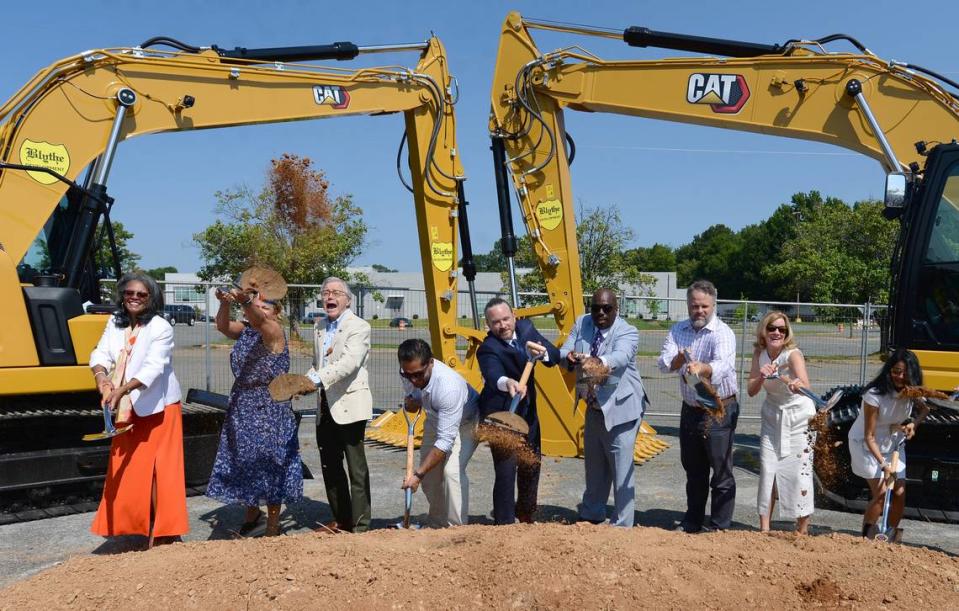 Charlotte City Council members toss dirt into the air during an Aug. 3, 2022 groundbreaking for a mixed-use project on a portion of the the long dormant Eastland Mall site. City leaders are now considering proposals for the rest of the site. Proposals include a tennis center, aquatic center and Target store.
