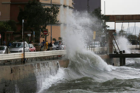 Big waves hit a waterfront as Typhoon Haima approaches in Hong Kong, China, October 21, 2016 . REUTERS/Bobby Yip