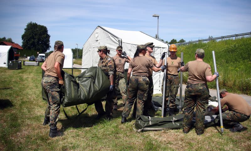 Soldiers of the German armed forces Bundeswehr build tents to be used as a testing site for the coronavirus disease (COVID-19) in Landau an der Isar