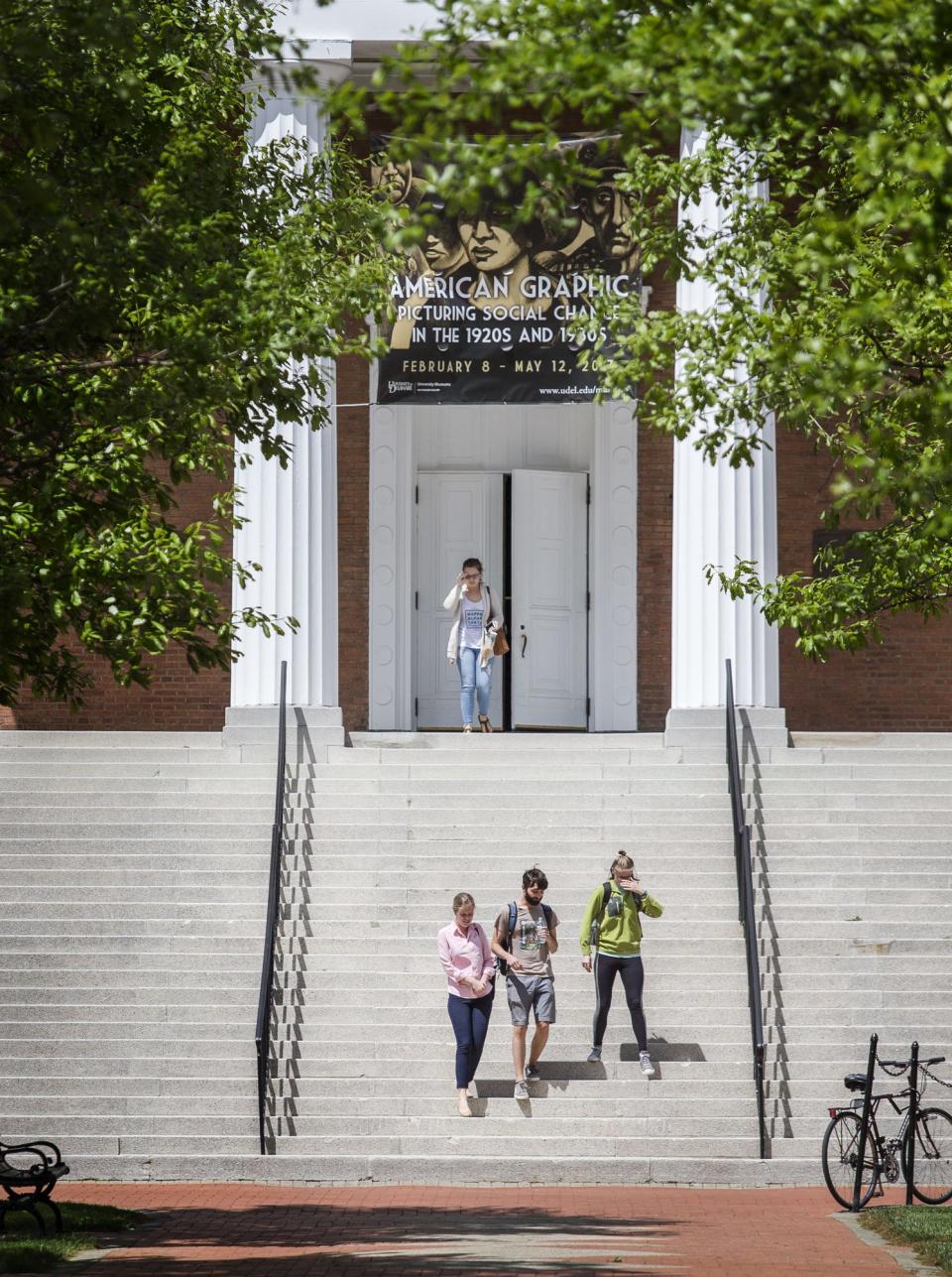 Students walk through the University of Delaware's campus in Newark on Wednesday afternoon in 2017.