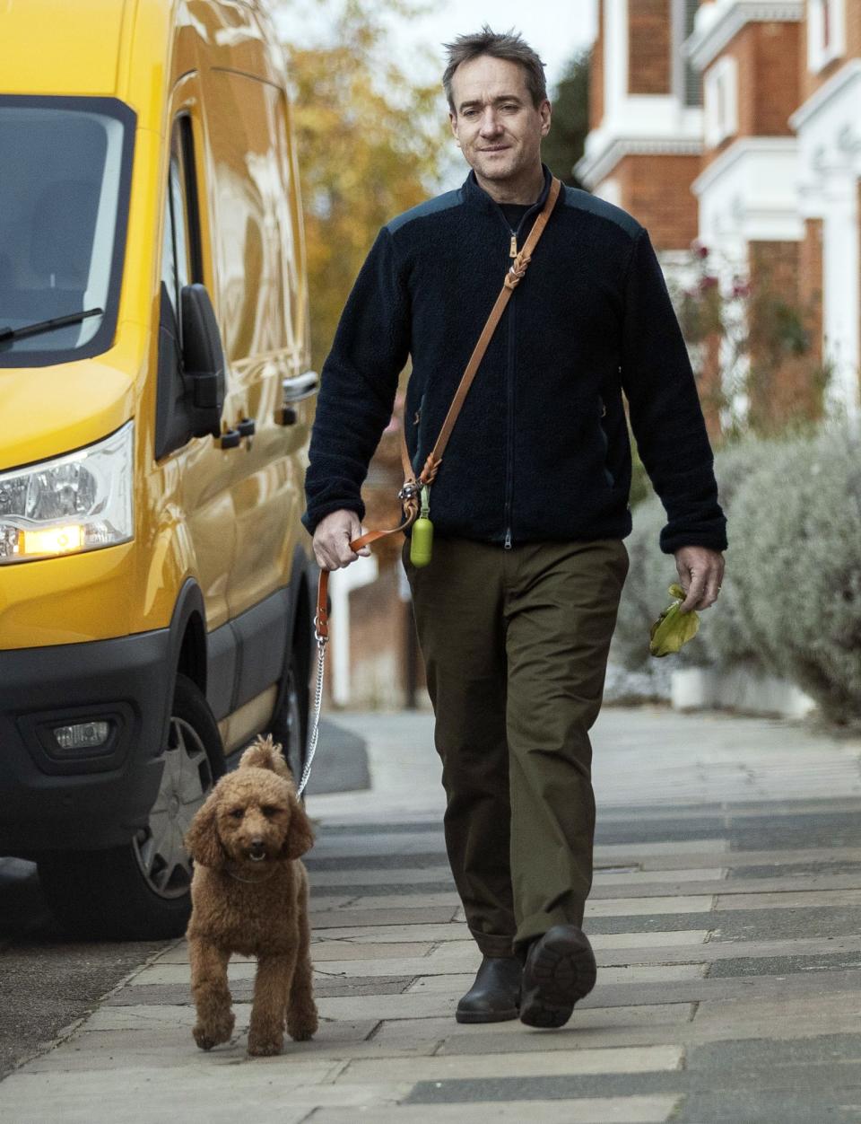 <p><em>Succession</em> star Matthew Macfadyen takes his dog for a walk in London on Nov. 29.</p>