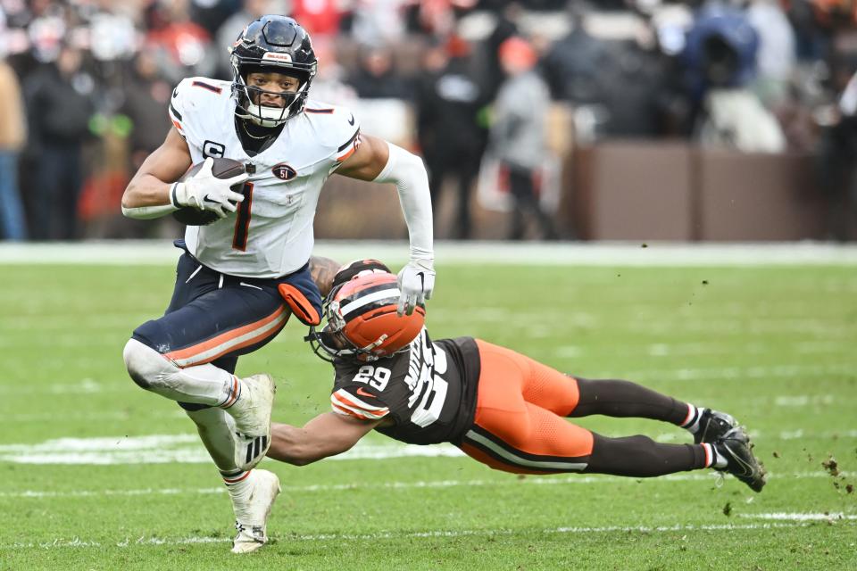 Browns cornerback Cameron Mitchell tackles Bears quarterback Justin Fields during the second half, Sunday, Dec. 17, 2023, in Cleveland.