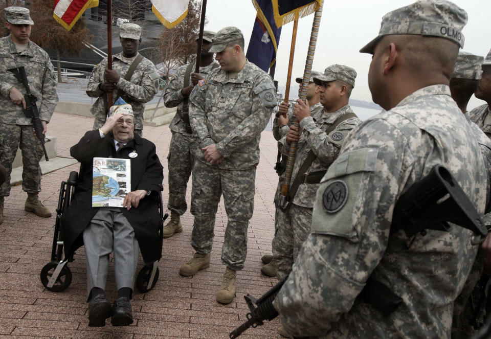 Pearl Harbor survivor Daniel Fruchter, of Eastchester, N.Y., salutes members of a color guard from his wheelchair during a visit at the Intrepid Sea, Air and Space Museum in New York, before ceremonies commemorating the 71st anniversary of the attack at Pearl Harbor, Friday, Dec. 7, 2012. President Barack Obama marked the day on Thursday by issuing a presidential proclamation, calling for flags to fly at half-staff on Friday and asking all Americans to observe the day of remembrance and honor military service members and veterans. (AP Photo/Richard Drew)