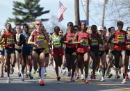 From left, Rita Jeptoo, Shalane Flanagan, Yeshi Esayias, Buzunesh Deba, Mare Dibaba, and Jemima Jelagat Sumgong run shortly after the start in the women's division of the 118th Boston Marathon Monday, April 21, 2014 in Hopkinton, Mass. (AP Photo/Michael Dwyer)