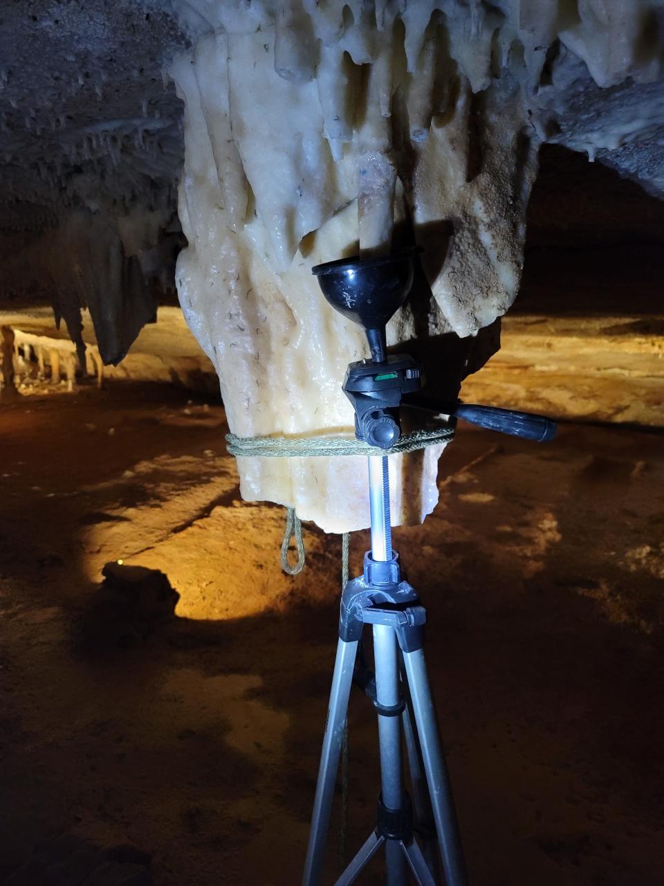 A tripod stabilizes a cave repair.