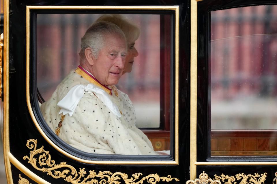 King Charles III and Camilla, Queen Consort traveling in the Diamond Jubilee Coach, built in 2012 to commemorate the 60th anniversary of the reign of Queen Elizabeth II, at Buckingham Palace ahead of the coronation on May 6, 2023, in London.