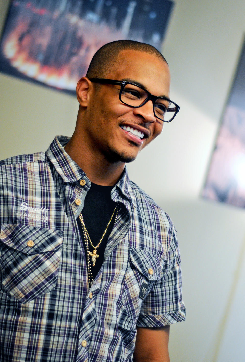 In this Sept. 10, 2012 photo, rapper T.I. is photographed during an interview in Atlanta. Even though T.I. has not produced any major hits lately, the Grammy-winning rapper believes he can still sell a considerable amount of albums based on his stellar track record. (AP Photo/Kat Goduco)