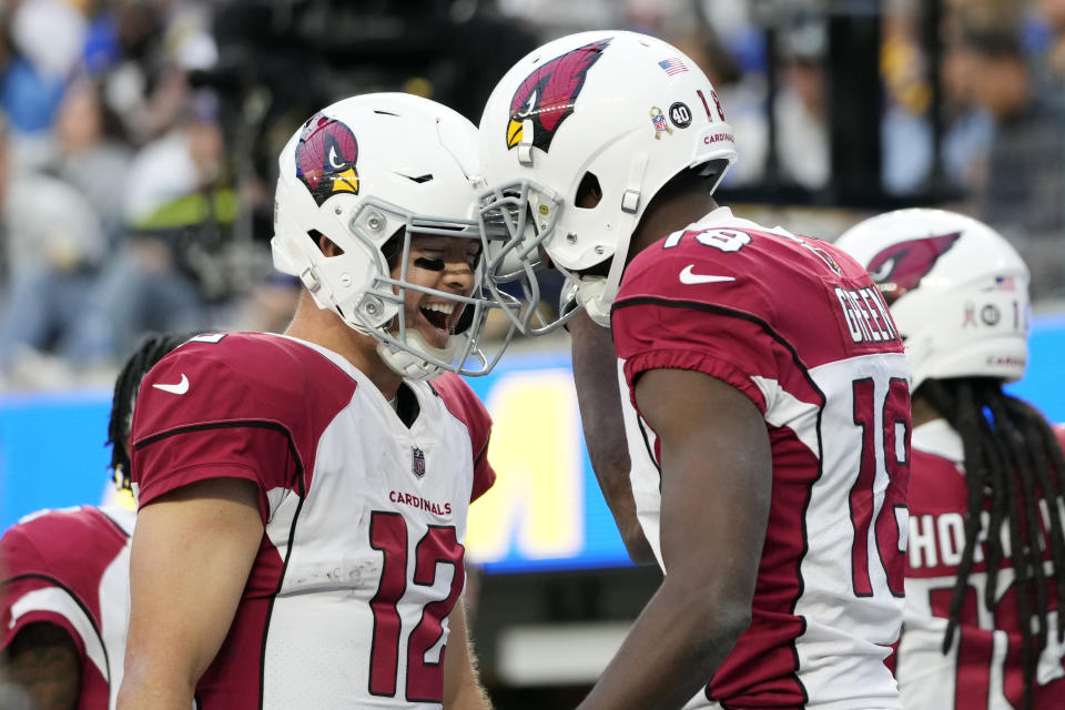 Arizona Cardinals quarterback Colt McCoy (12), left, celebrates after throwing a touchdown pass to wide receiver A.J. Green, right, during the first half of an NFL football game Sunday, Nov. 13, 2022, in Inglewood, Calif. (AP Photo/Jae C. Hong)