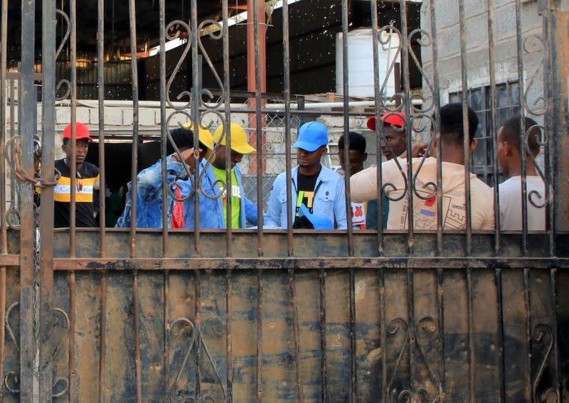 Ethiopian migrants prepare to leave an IOM shelter before they were flown back to Ethiopia, in Aden