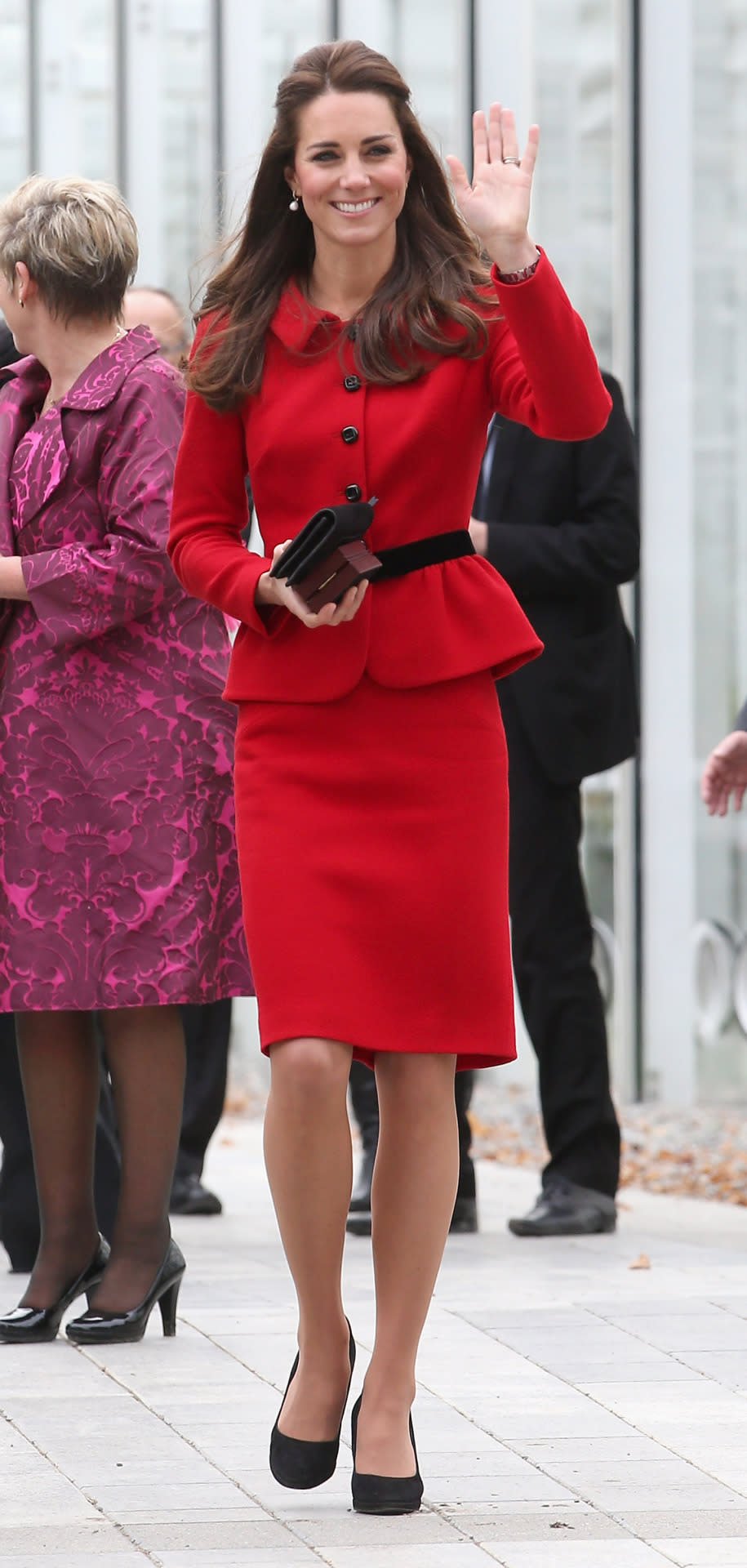 <p>While opening the Visitor’s Centre at the Botanical Gardens in Christchurch, Kate rocked a pillar-box red two-piece - reminiscent of outfits Princess Diana was famous for wearing. <i>Photo: Rex]</i></p>