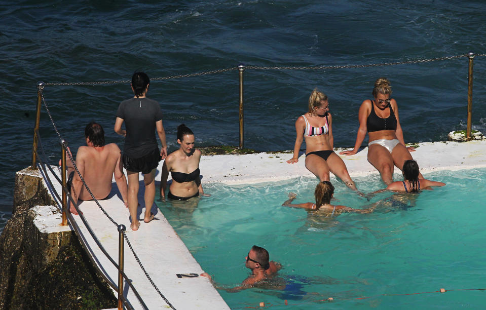 Bondi will reach 35 degrees on Thursday. Pictured are swimmers in a pool.