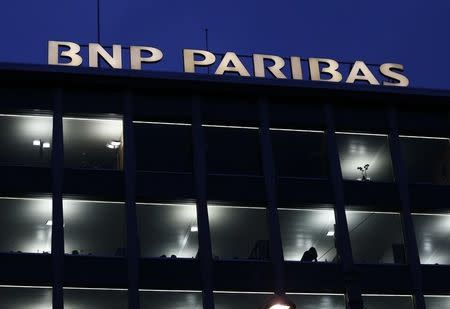 A BNP Paribas sign is pictured on a building of the bank in Geneva November 26, 2014. REUTERS/Denis Balibouse