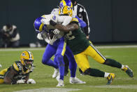 Green Bay Packers' Rashan Gary (52) sacks Los Angeles Rams quarterback Jared Goff during the second half of an NFL divisional playoff football game Saturday, Jan. 16, 2021, in Green Bay, Wis. (AP Photo/Mike Roemer)