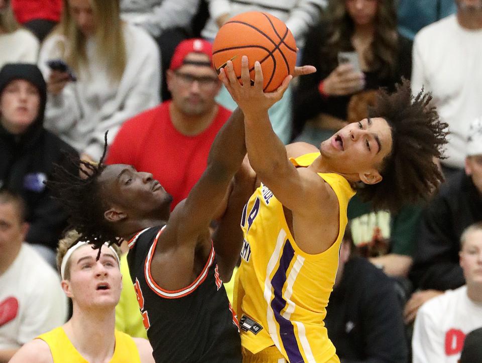 Wasatch Academy’s Chris Nwuli and Montverde Academy’s Asa Newell reach for the ball during a National Hoopfest Utah Tournament game at Pleasant Grove High School in Pleasant Grove on Monday, Nov. 20, 2023. Montverde won 88-53. | Kristin Murphy, Deseret News