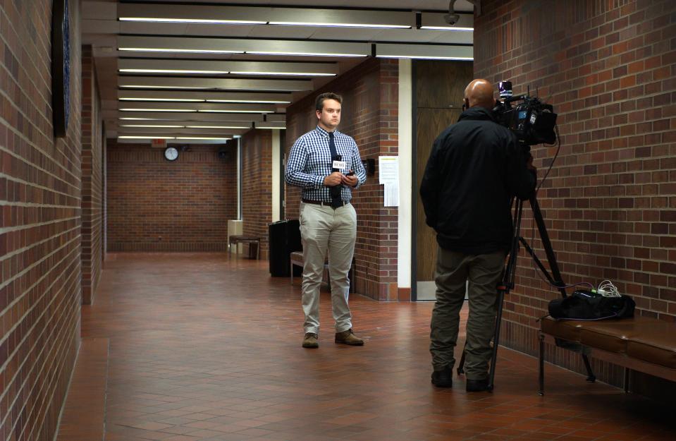 A television reporter and cameraman prepare to film outside a Vanderburgh County courtroom on Monday, May 6, 2024, after Elizabeth Fox-Doerr’s murder trial adjourned for the day.