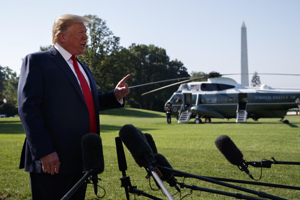 President Donald Trump talks with reporters before departing for an event to celebrate the 400th anniversary celebration of the first representative assembly at Jamestown, on the South Lawn of the White House, Tuesday, July 30, 2019, in Washington. (AP Photo/Evan Vucci)