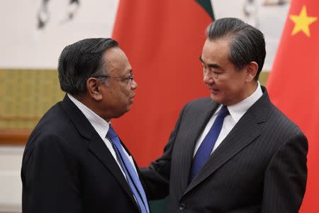 Bangladesh's Foreign Minister Abul Hassan Mahmood Ali (L) chats with China's Foreign Minister Wang Yi before a meeting at the Diaoyutai State Guesthouse in Beijing, China June 29, 2018. Greg Baker/Pool via REUTERS