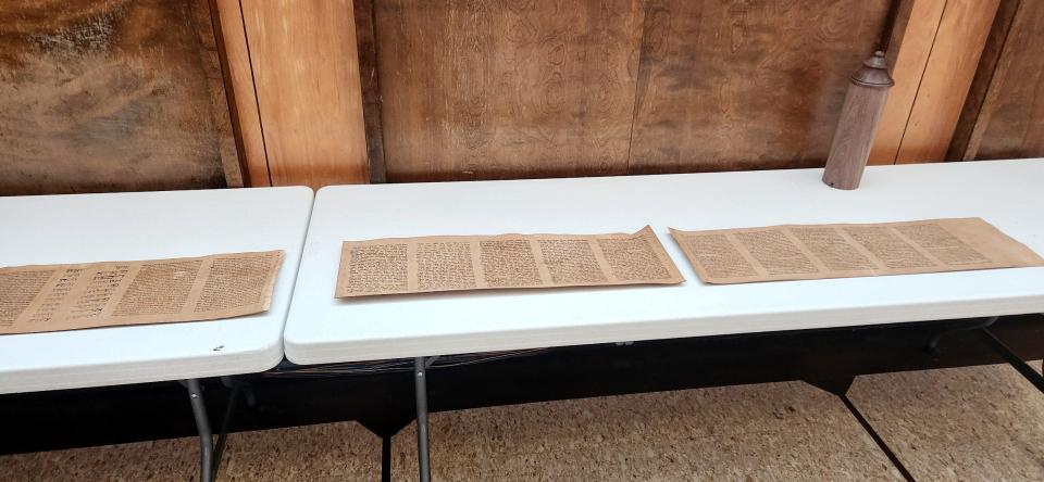 A scroll of the Book of Esther that was made by members of The Kedusha Project based in Oklahoma is shown on a table at Emanuel Synagogue in Oklahoma City.