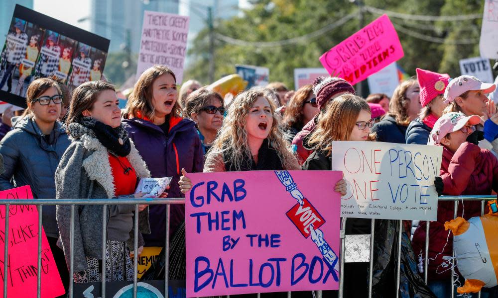 Women gather for a rally and march at Grant Park on 13 October in Chicago, Illinois to inspire voter turnout ahead of midterm elections. 