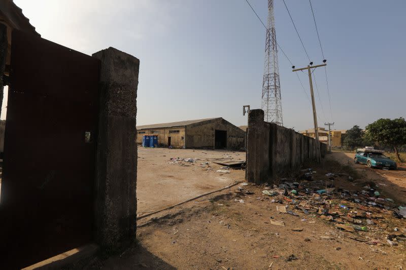 A car drives past a warehouse used by NEMA to store foods and other essentials in Abuja