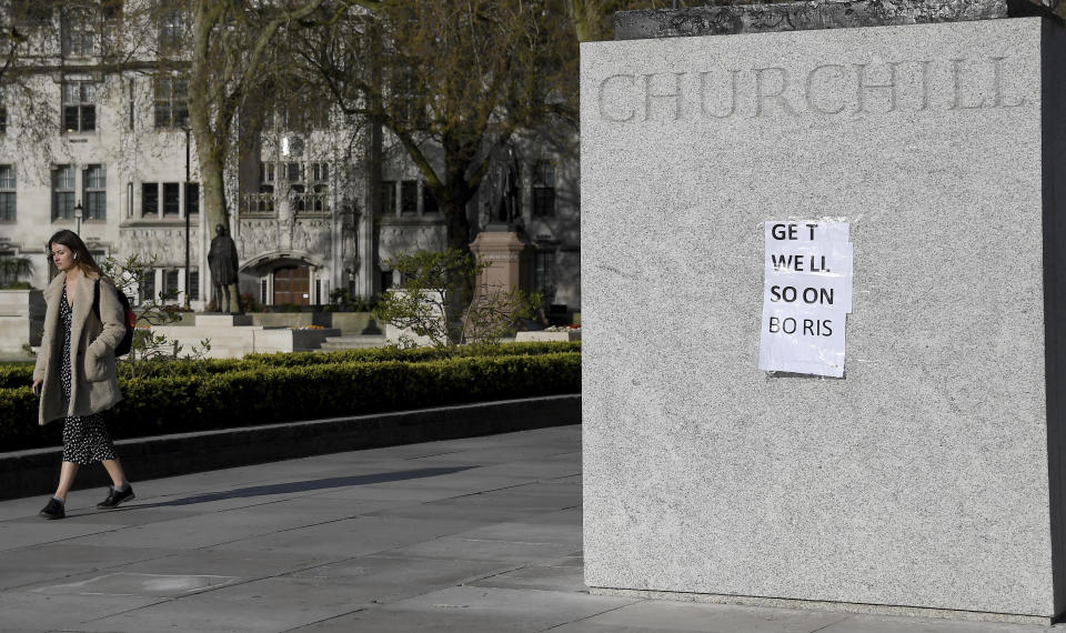 People have put a paper saying 'Get Well Soon Boris' on the statue of Winston Churchill in central London as British Prime Minister Boris Johnson was moved to intensive care after his coronavirus symptoms worsened in London, Tuesday, April 7, 2020. Johnson was admitted to St Thomas' hospital in central London on Sunday after his coronavirus symptoms persisted for 10 days. Having been in hospital for tests and observation, his doctors advised that he be admitted to intensive care on Monday evening. The new coronavirus causes mild or moderate symptoms for most people, but for some, especially older adults and people with existing health problems, it can cause more severe illness or death.(AP Photo/Alberto Pezzali)