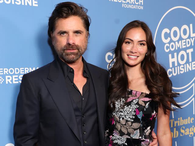 <p>Matt Winkelmeyer/Getty</p> John Stamos and Caitlin McHugh attend Cool Comedy Hot Cuisine: A Tribute to Bob Saget at Beverly Wilshire on September 21, 2022.