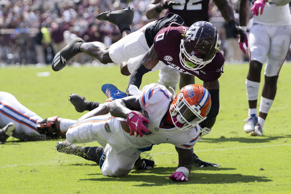 Florida wide receiver Kadarius Toney (1) is stopped just short of the goal line by Texas A&M defensive back Myles Jones (0) during the second quarter of an NCAA college football game, Saturday, Oct. 10, 2020, in College Station, Texas. (AP Photo/Sam Craft)