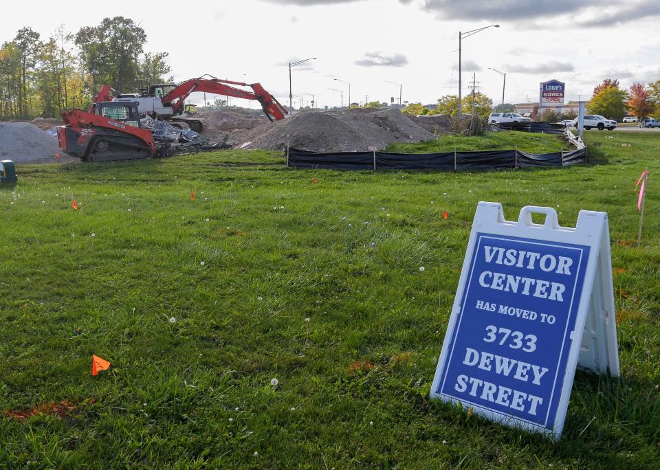 A sign tells visitors to the Manitowoc Visitor Center that they have moved as seen, Thursday, September 28, 2023, in Manitowoc, Wis. Crews are working on cleaning the lot up after the building’s demolition.