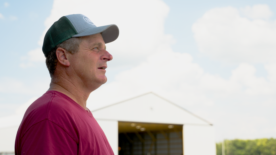 Dave Kress, who farms corn and soy, stands outside his barn and fields just north of Dayton, Ohio. He is one of many farmers across the region who is feeling the squeeze from soaring supply costs as well as shortages.