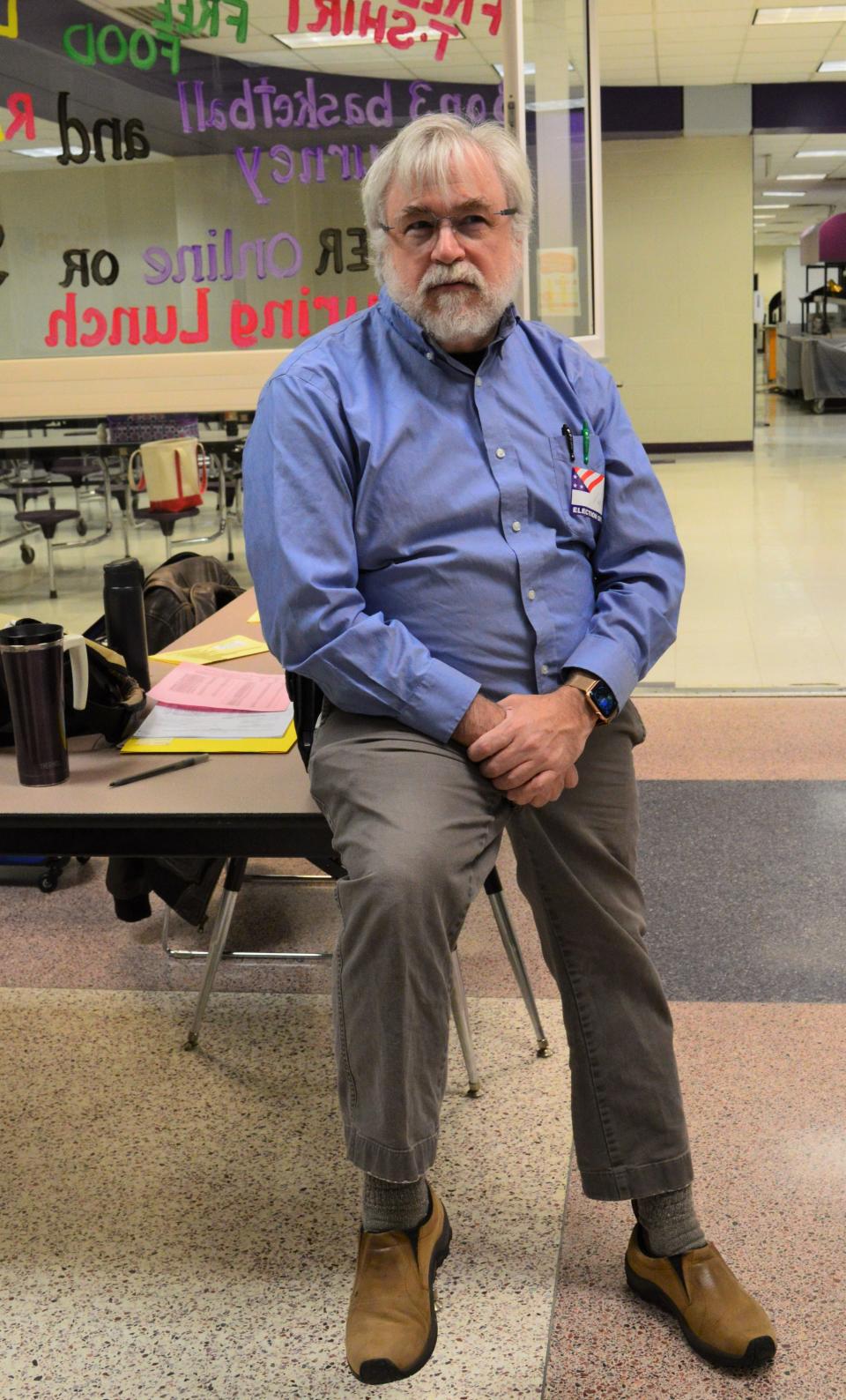 Kurt Seiffert, inspector at the Bloomington South polling site, watches over all the activity at the site during the election today.