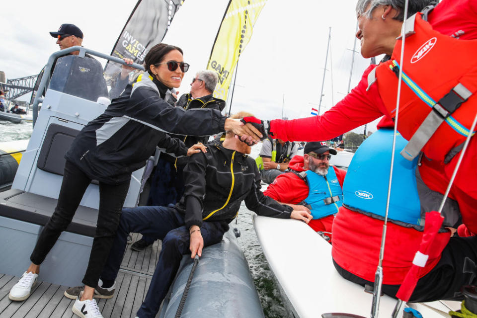 Meghan Markle, Duchess of Sussex, and Prince Harry, Duke of Sussex sail across Sydney harbor at Sydney Olympic Park on October 21, 2018 in Sydney, Australia. (Photo: Pool/Samir Hussein/WireImage)