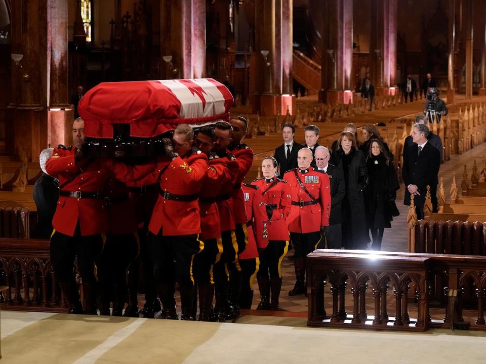 Members of the Mulroney family follow as the casket of former prime minister Brian Mulroney is carried into St. Patrick's Basilica where he will lie in repose in Montreal on Thursday.