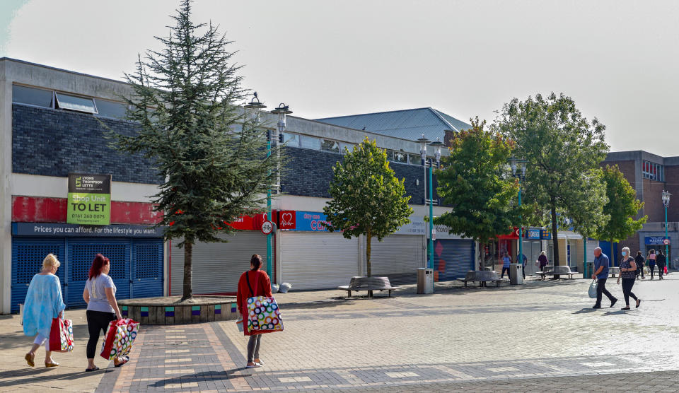 The changing face of the high street. Shoppers walk through Huyton Village Shops, in Knowsley, Merseyside, many of which are closed, some six months on from the evening of March 23 when Prime Minister Boris Johnson announced nationwide restrictions.