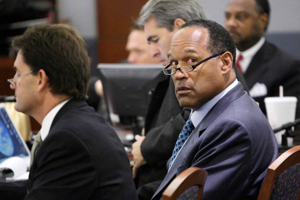 <p>Jae C. Hong-Pool/Getty</p> O.J. Simpson (right) sits with his attorney Yale Galanter (left) and attorney Gabe Grasso (center)at the start of closing arguments for his trial at the Clark County Regional Justice Center on Oct. 2, 2008 in Las Vegas