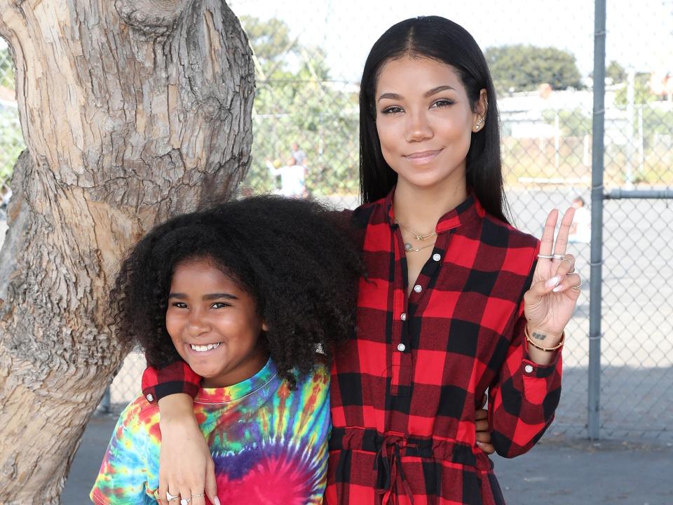 Jhene Aiko, pictured with daughter Namiko, launches #PennysPen National Day on Writing Campaign with Get Schooled at Baldwin Hills Elementary School on October 20, 2017 in Los Angeles, California