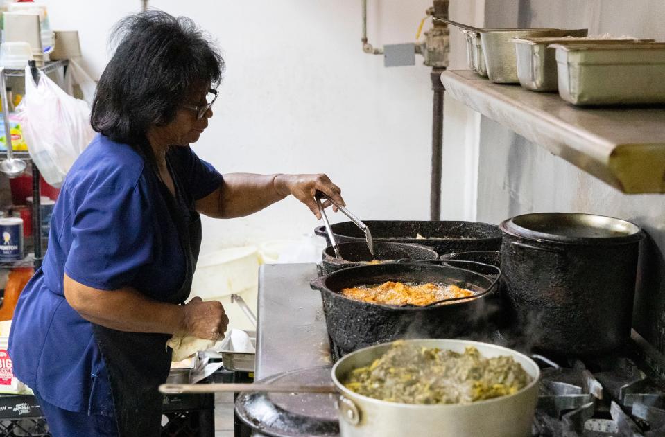 Owner Willistine Myrick cooks in the kitchen on the last day her restaurant Stein’s is open Friday, July 1, 2022, in Memphis. Stein’s has been open for 44 years but is now closing as Myrick is retiring. 