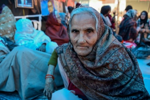 For nearly four weeks, Noornissa and more than 200 other women have sat and slept across the four-lane road