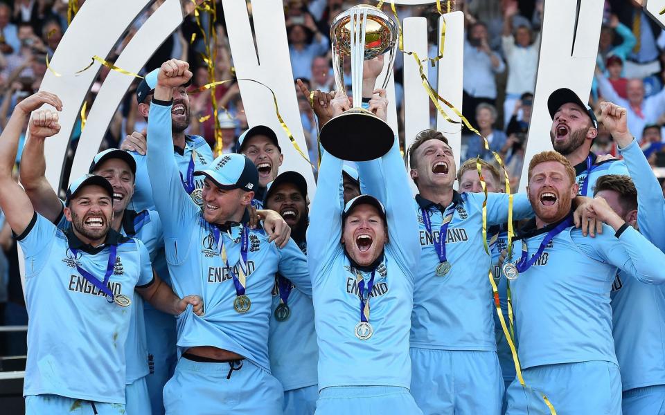 England's captain Eoin Morgan lifts the World Cup trophy on the pitch after the 2019 Cricket World Cup final between England and New Zealand at Lord's - Glyn Kirk/AFP