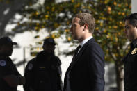 Facebook Chief Executive Officer Mark Zuckerberg arrives for a hearing before the House Financial Services Committee on Capitol Hill in Washington, Wednesday, Oct. 23, 2019, to discuss his plans for the new cryptocurrency Libra. (AP Photo/Susan Walsh)