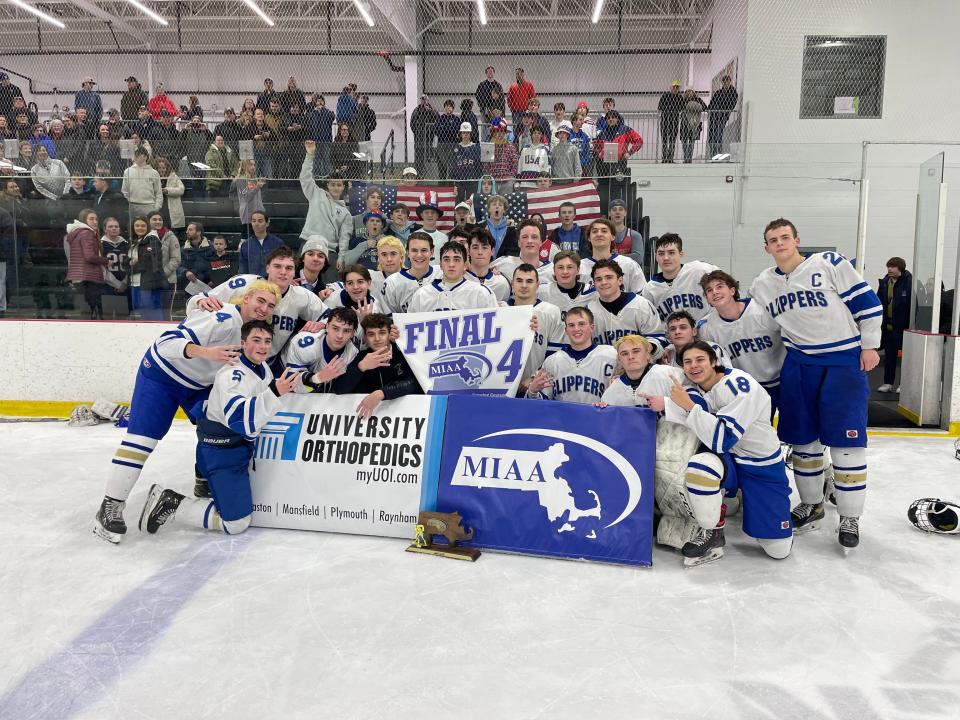 The Norwell High boys hockey team poses with the MIAA Division 4 Final 4 trophy and banner after defeating Martha's Vineyard, 5-0, on Wednesday, March 9, 2023.
