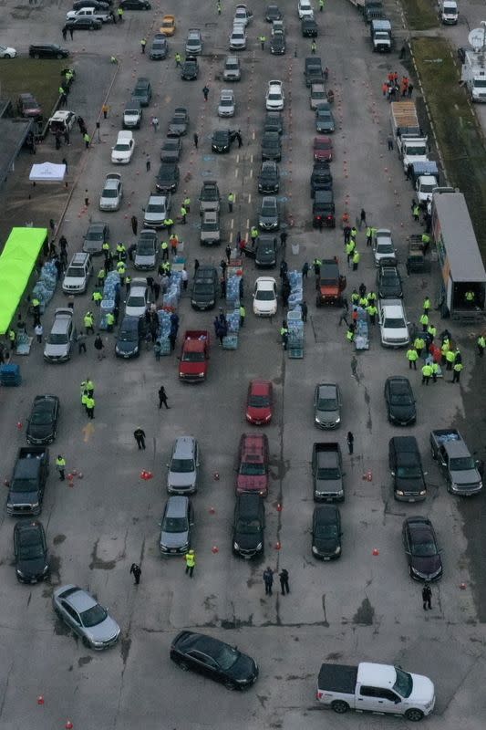 Residents line up to receive water following an unprecedented winter storm in Houston, Texas