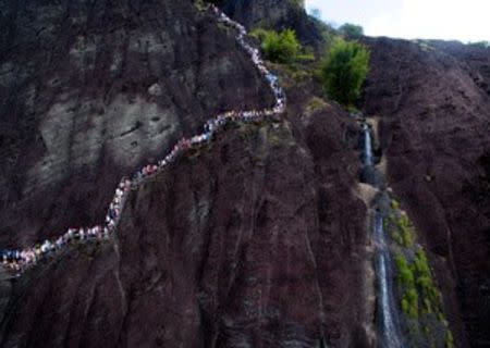 Visitors walk on a path at Wuyi mountain in Nanping, Fujian Province, China, October 3, 2016. REUTERS/Stringer