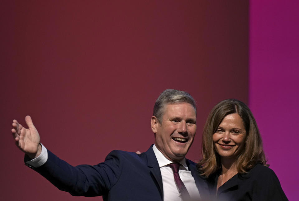 FILE - Leader of the British Labour Party Keir Starmer gestures as he stands with his wife Victoria after making his keynote speech at the annual party conference in Brighton, England, Wednesday, Sept. 29, 2021. (AP Photo/Alastair Grant, FIle)