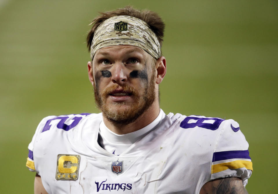 FILE - Minnesota Vikings tight end Kyle Rudolph walks off the field after an NFL football game against the Chicago Bears, Nov. 16, 2020, in Chicago. Two-time Pro Bowl tight end Rudolph has retired after a 12-year career in the NFL he spent mostly with the Vikings. (AP Photo/Kamil Krzaczynski, File)