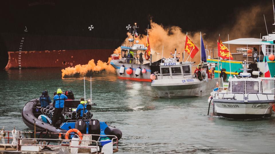 <p>Fishing vessels at sea off the coast of Jersey on Thursday</p> (AP)