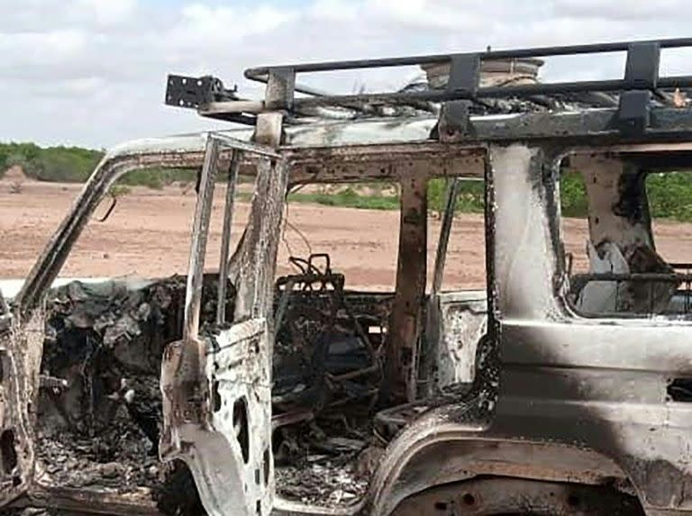 The burnt-out vehicle of eight people, including French aid workers, that was attacked by unidentified gunmen in southwest Niger. Source: AFP 