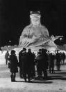 Visitors to the 22nd Sapporo Snow Festival on the island of Hokkaido in Japan admire an ice statue of Benten, a goddess of luck, music, eloquence, art and fortune.