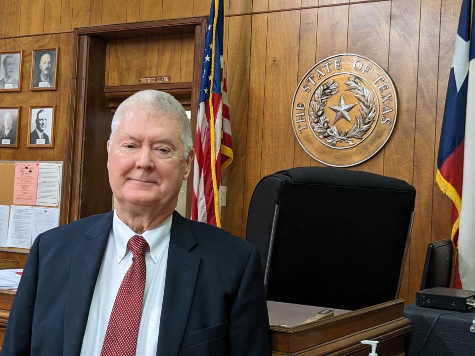 Longtime Judge Jack McGaughey retired May 31, 2023, as 97th District judge. He stands in front of the bench at the Clay County Courthouse in Henrietta May 15, 2023, just before a retirement party in his honor.