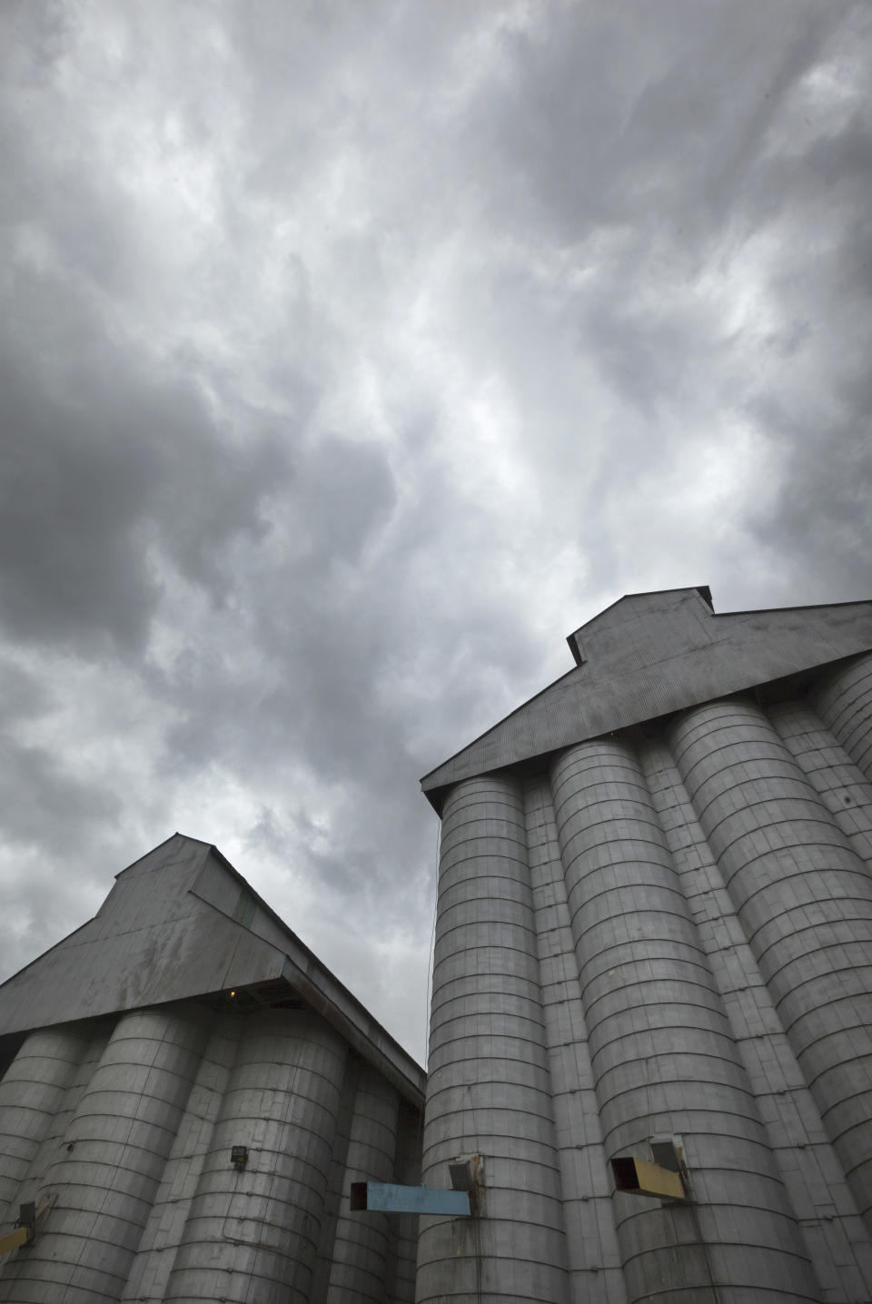 Storm clouds leading remnants of Hurricane Isaac gather in the skies over a grain elevator in England, Ark., Thursday, Aug. 30, 2012. With the storms approaching many farm states, some farmers wonder whether too much relief is on the horizon. (AP Photo/Danny Johnston)