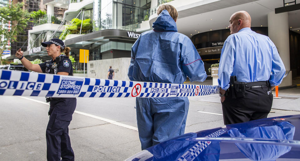 The forensic scene where police shot and killed a man outside the Westin Hotel on Mary Street in central Brisbane, Sunday, February 23, 2020.(AAP Image/Glenn Hunt) NO ARCHIVING